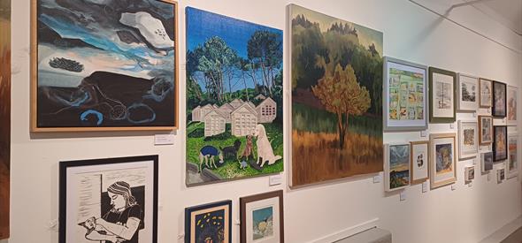 Paintings hung in an exhibition