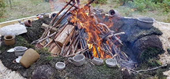 a small bonfire firing pottery