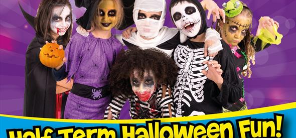 Poster with Half Term Halloween Fun Adventure Wonderland written on it with children dressed in halloween costumes