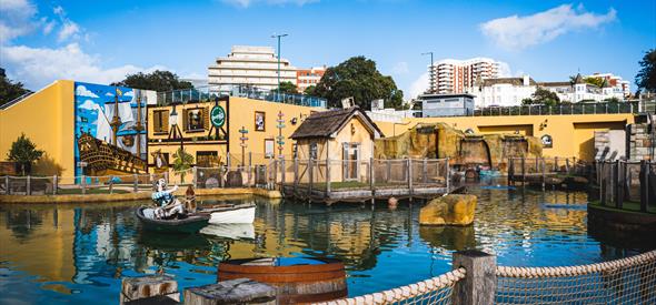Smugglers Cove Adventure Golf shot of course and water feature on a sunny day
