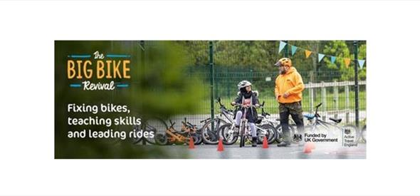 Big Bike Revival Poster with a man helping a little boy fix his bike