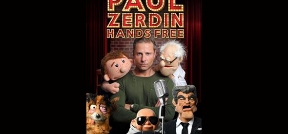 Man in green jumper surrounded by puppets