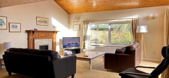 Warm, modern and cosy interior of chalet with wooden details