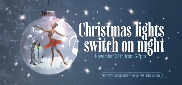 Ballerina and two penguins in a bauble with the text christmas lights switch on night.