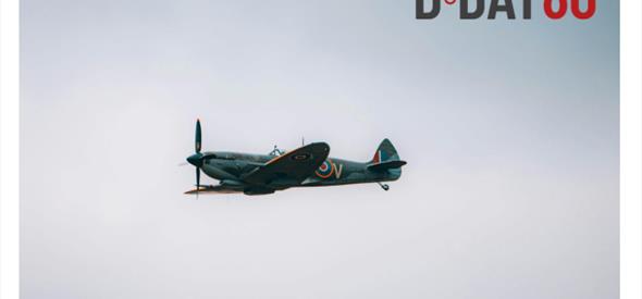 spitfire in the sky in an army green