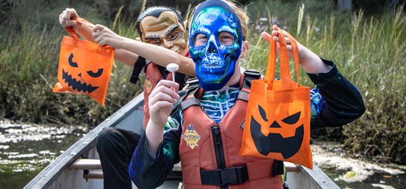 Children enjoying a Halloween Candy Canoe Hunt
