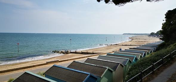 Friars Cliff Beach Huts view west towards Mudeford and Bournemouth.