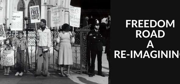Black and White image of people protesting outside a fence.