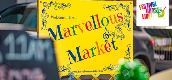 The words 'Marvellous Market' on a bright yellow sign