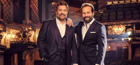 Michael Ball and Alfie Boe standing together in the theatre