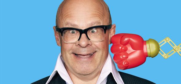 Image of Harry Hill, with a boxing glove about to hit him