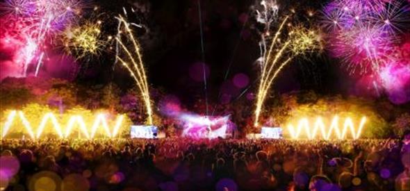 A stage with fireworks and the crowd