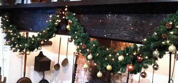 Christmas decorations over fireplace.