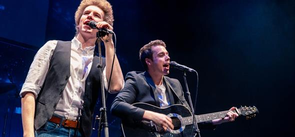 Two men tribute band singing on stage