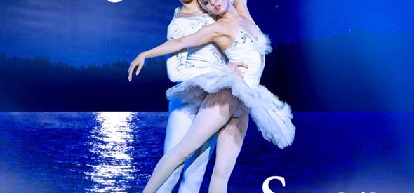 Two ballet dancers performing Swan Lake on a blue background