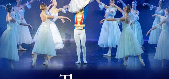 Ballet Dancers performing a lift on stage