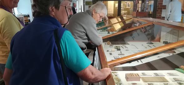 Group of people looking around museum