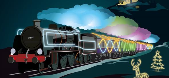 Colourful decorated illuminated steam train flying past Corfe Castle, reindeer and a Christmas tree