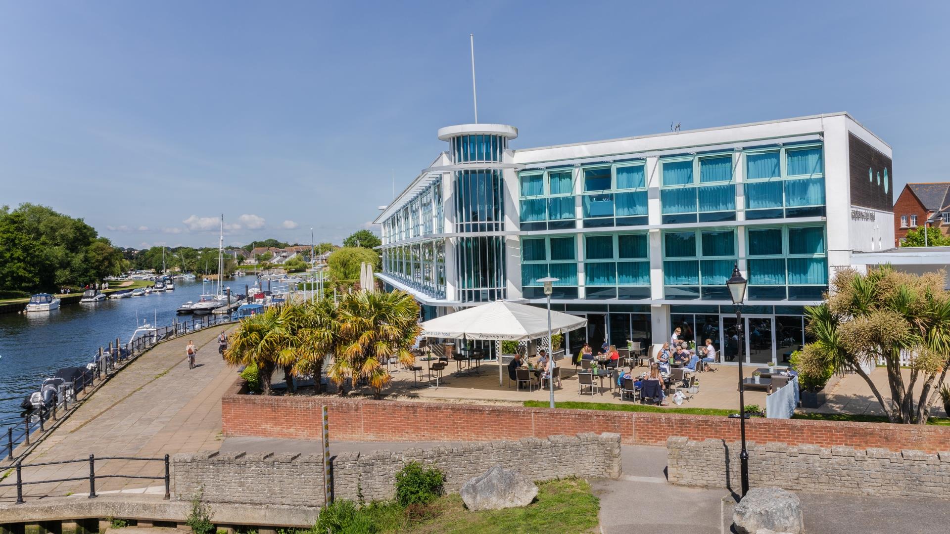 Exterior shot of Christchurch hotel with river run alongside