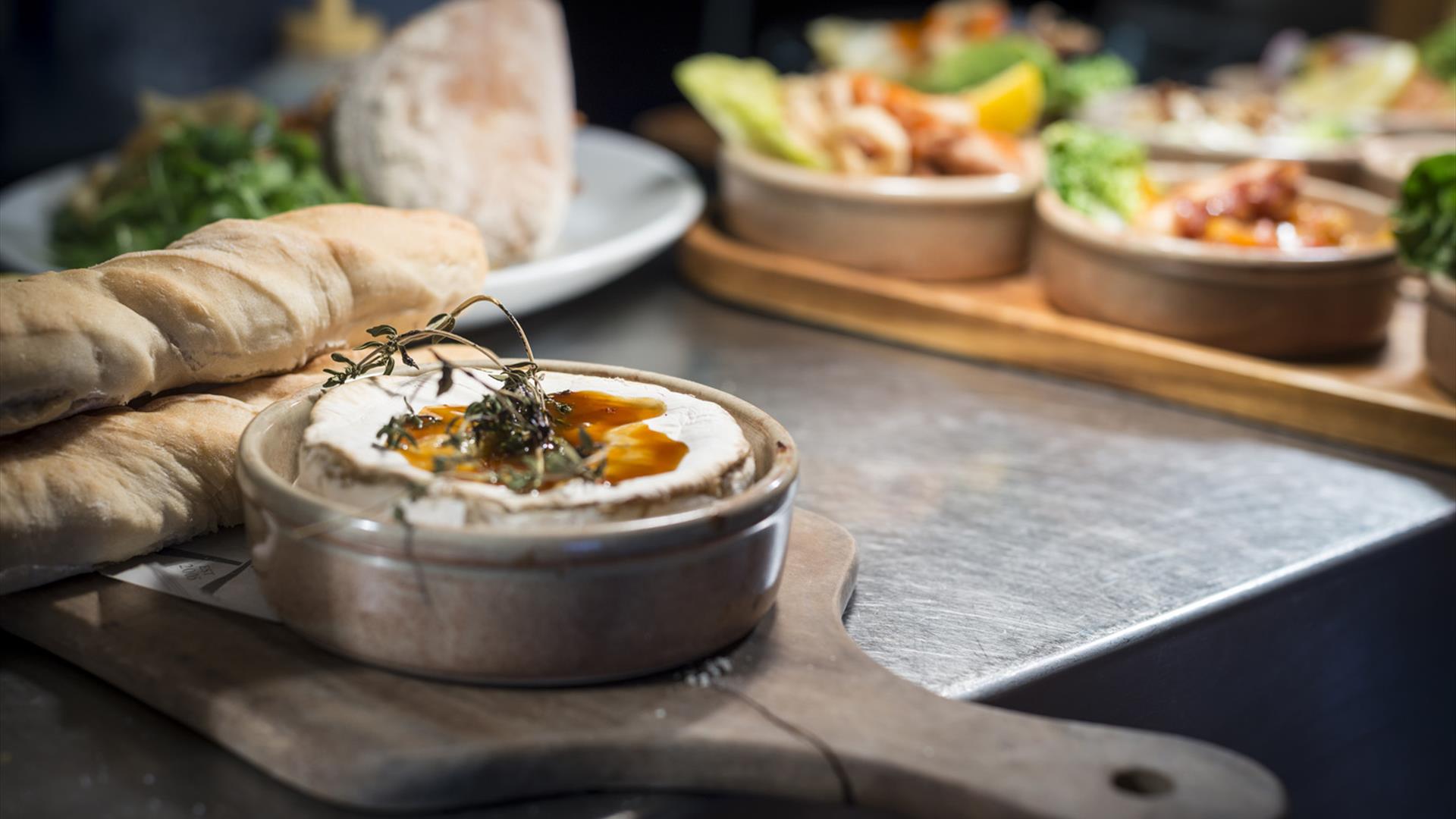Cheese and other food starters waiting to be taken to tables