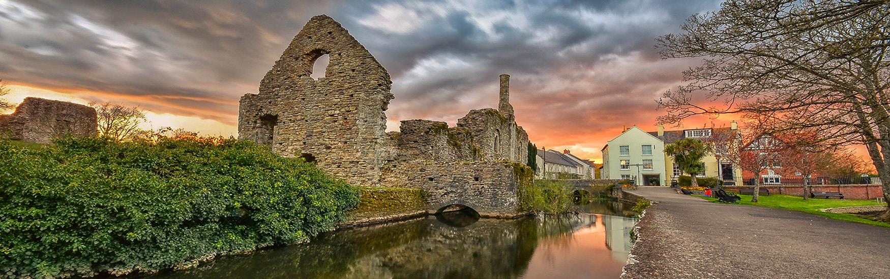 Old ruins found in Christchurch with a beautiful orange sky behind