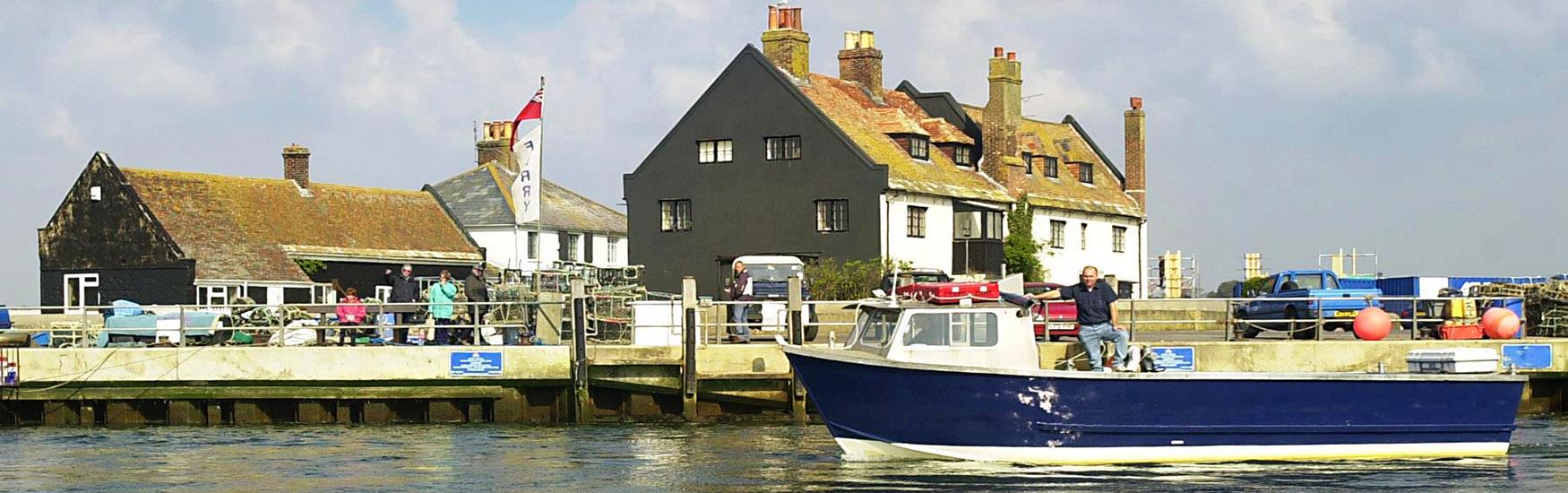Mudeford Ferry moored alongside the quay