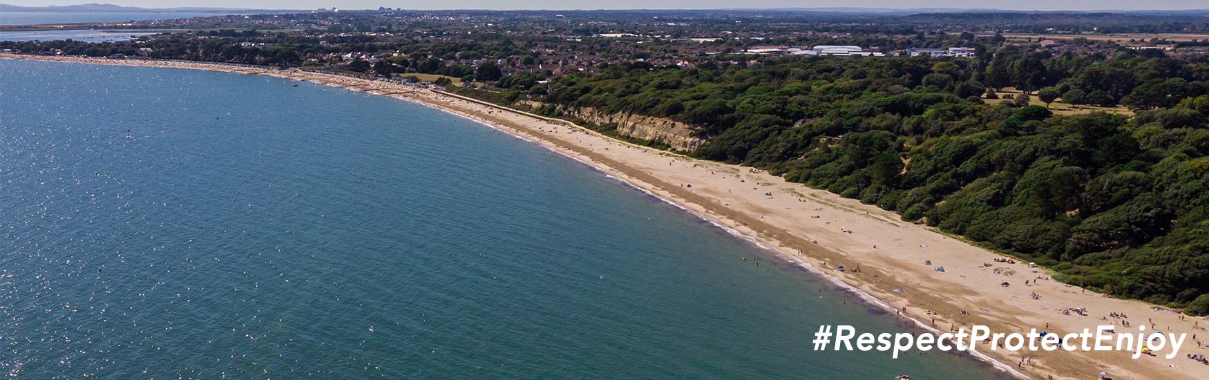 Christchurch Bay from above with the text: Respect, Protect, Enjoy.