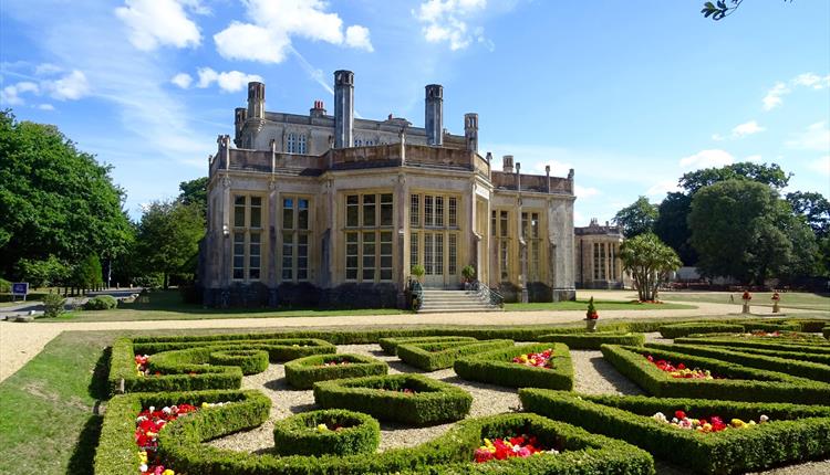 Castle on sunny day with Parterre hedge in the foreground