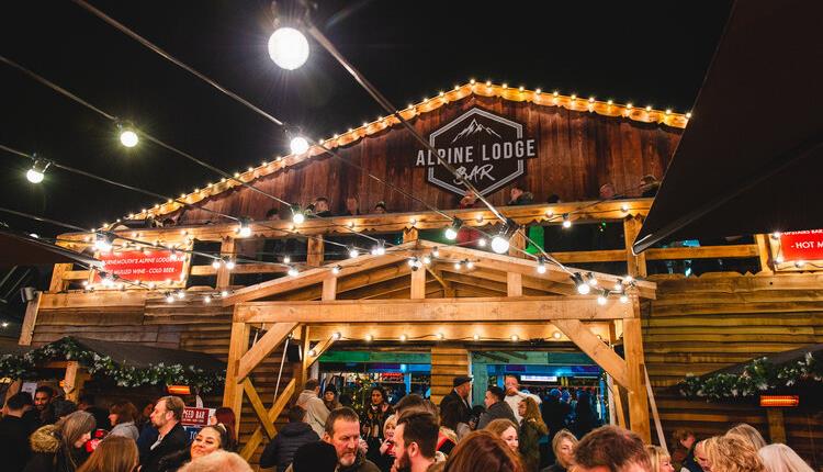 Visitors enjoying outdoor drinks at the Apline Lodge Bar in bournemouth