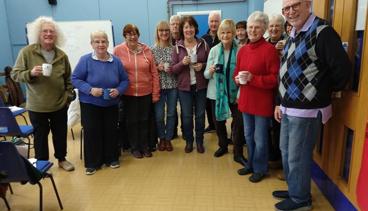 Older community members smiling at camera