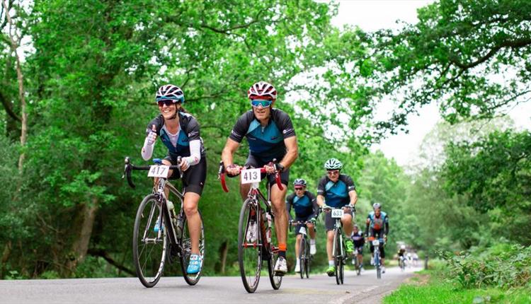 Group of cyclists riding on the road for Garmin Ride out