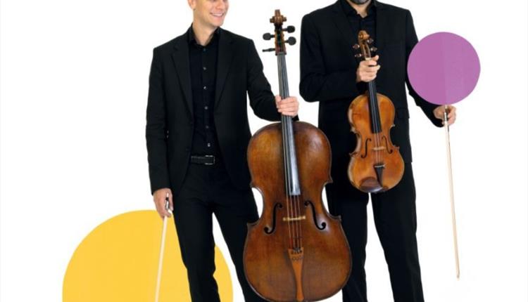 A violinist and a cellist against a white background