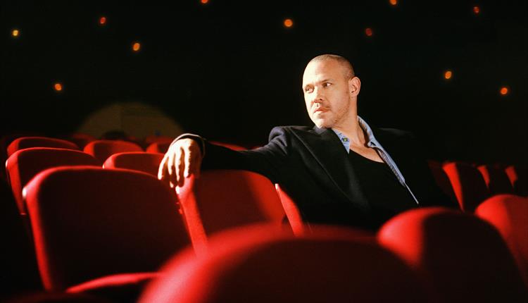 Will Young sitting in a chair looking away from the camera