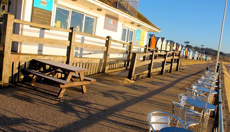 Beach hut cafe in the bright sunlight.