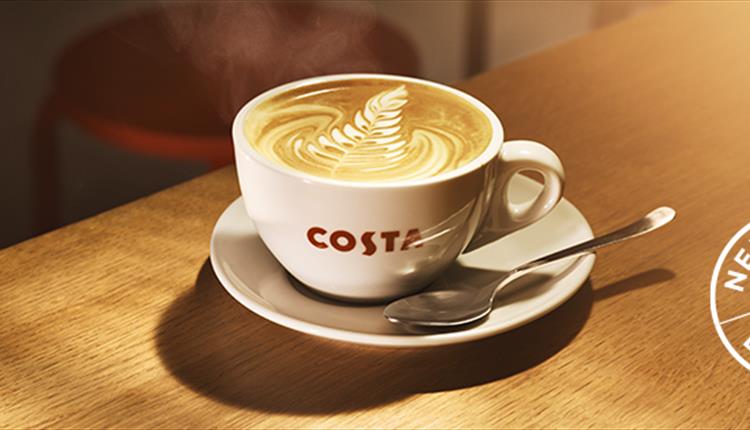 cup of costa coffee on a wooden bench.