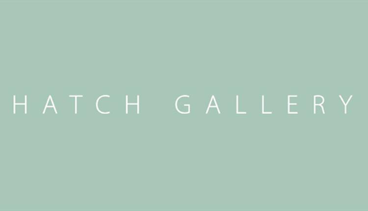 Hatch Gallery white text on green logo book-ended by martini glasses.