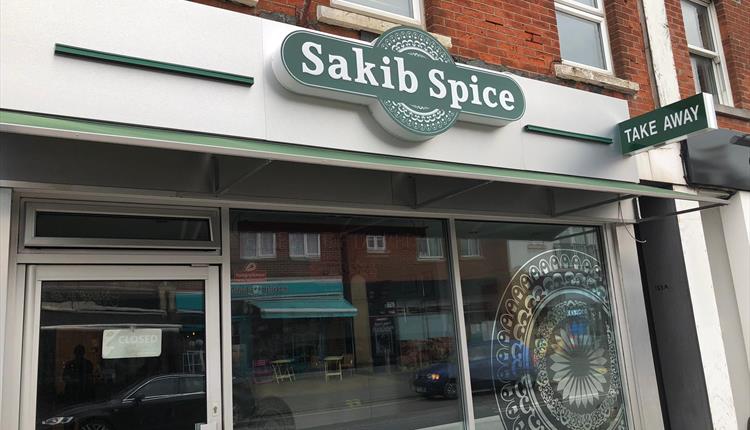 Sakib spice outside of restaurant.