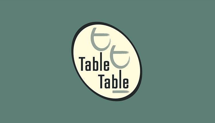 table table logo on green background.