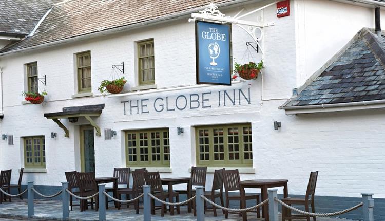 globe inn pub exterior painted white.