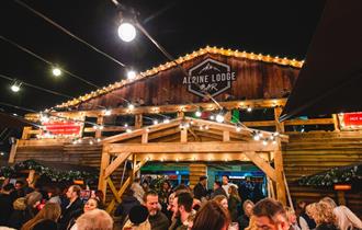 Visitors enjoying outdoor drinks at the Apline Lodge Bar in bournemouth
