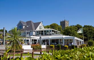 The Boathouse from outside with the Priory in the background
