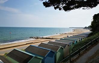 Friars Cliff Beach Huts view west towards Mudeford and Bournemouth.