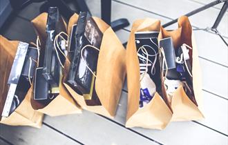 shopping bags full of clothes