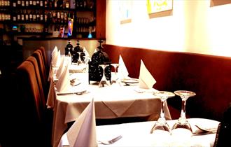 inside of restaurant laid out for dining.