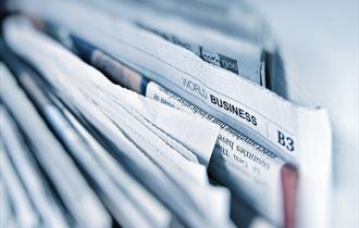 newspapers in a stack.