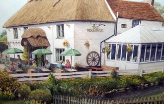 painting of people enjoying the Woolpack on a warm sunny day.