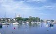 Christchurch Quay with boats and the Priory church