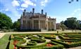 Castle on sunny day with Parterre hedge in the foreground