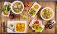Table with white plates with food on