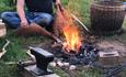 A fire being used to turn stone into metal